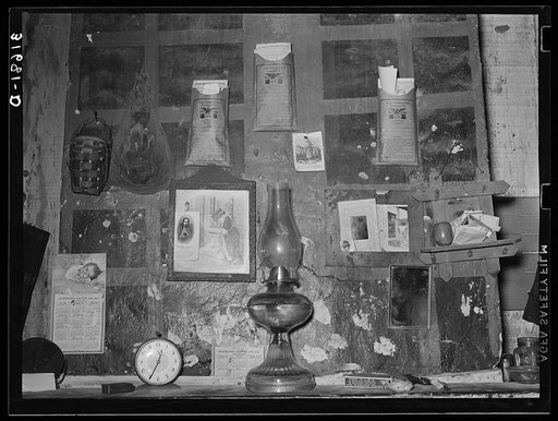 Decorations above mantle in Negro home along the levee. Norco, Louisiana. Note the life insurance policies