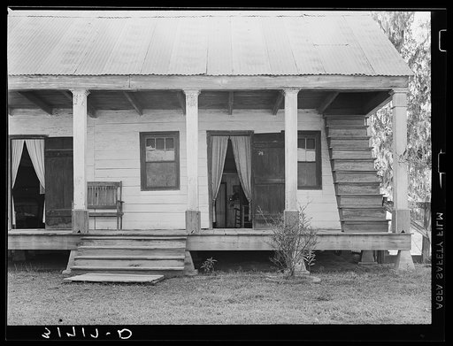 Detail of house with outside stairway to attic. Near Breaux Bridge, Louisiana