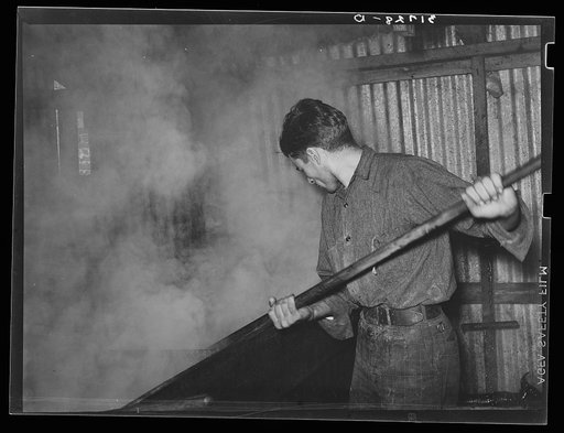 Untitled photo, possibly related to: Ladling syrup from boiling vat to concentration vat at syrup mill near New Iberia, Louisiana