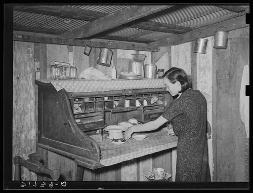 Kitchen of son of W.E. Smith. Old desk has been converted into table and cabinet. Near Morganza, Louisiana