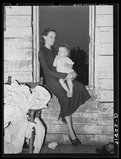 Daughters of the Allen family near Morganza, Louisiana, sitting in the window