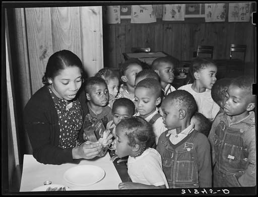 Children in nursery school getting cod liver oil. Lakeview Project, Arkansas