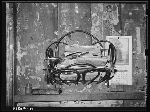 Magazine rack in home of FSA (Farm Security Administration) client who will move onto Transylvania Project. Louisiana