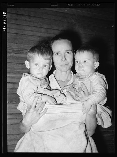 Untitled photo, possibly related to: Mrs. Scarbrough with two youngest children. Laurel, Mississippi