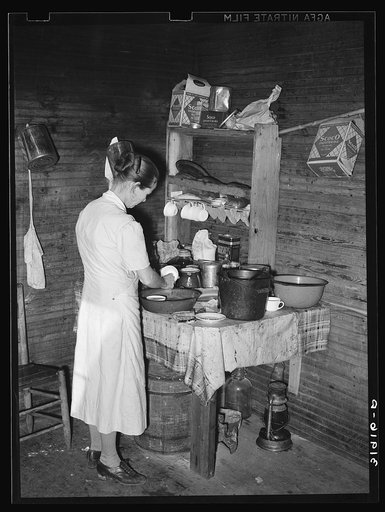 Mrs. Scarbrough in corner of kitchen. Laurel, Mississippi