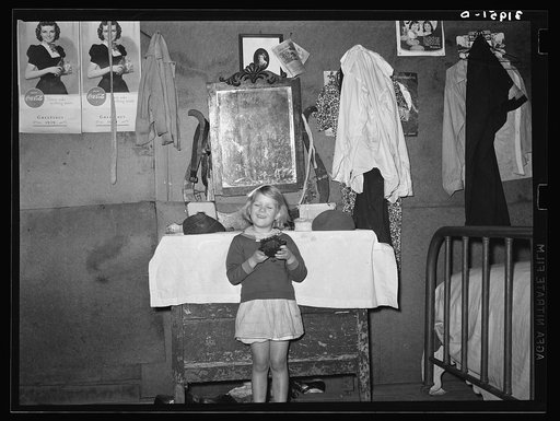 Child of Ed Bagget, sharecropper, in front of bureau. Near Laurel, Mississippi