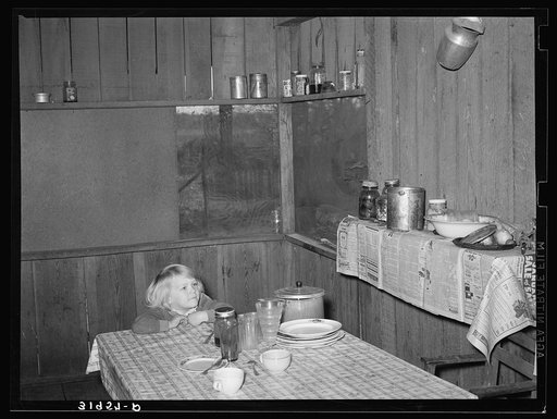 Corner of kitchen and dining room in Ed Bagget's house. Sharecropper kitchen is screen but otherwise open. Near Laurel, Mississippi