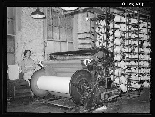 Warp winding machine with operator. Laurel mills, Laurel Mississippi