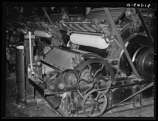 Pulling cotton into cotton "ropes" which, in later processes, are combined to make thread. Laurel mills, Laurel, Mississippi