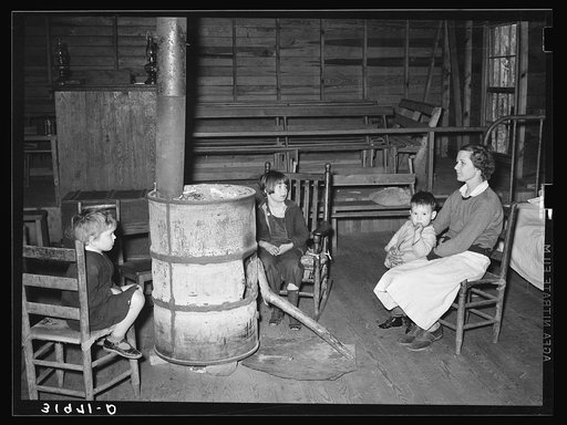 Mother and three children living in abandoned church because of acute housing conditions. Near Laurel, Mississippi