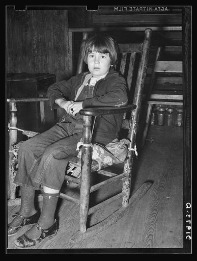 Child of family living in abandoned church near Laurel, Mississippi