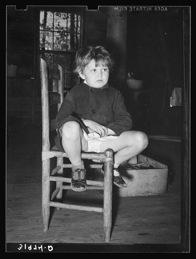 Child of family living in abandoned church near Laurel, Mississippi