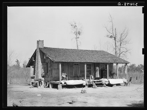 Farmhouse near Antioch with mattresses and bedding being aired. Mississippi