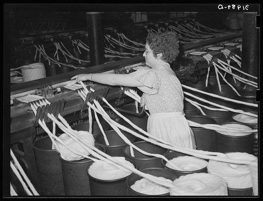 Threading cotton ropes into thread-making machine. Laurel cotton mill, Laurel, Mississippi