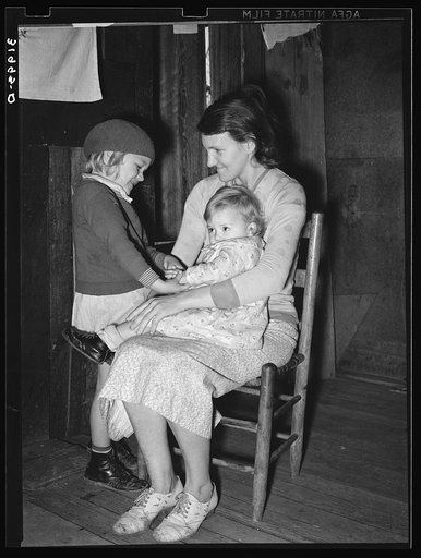 Mrs. Bagget and two children. Wife of sharecropper near Laurel, Mississippi