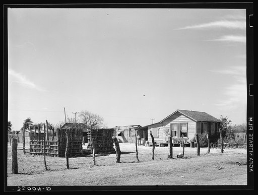 Home and yard of Mexican day laborer who works in vegetable fields near Santa Maria, Texas
