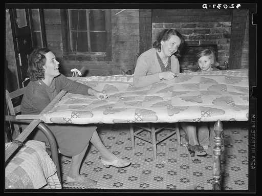 Untitled photo, possibly related to: Quilting in sharecropper's home near Pace, Mississippi. Background photo for Sunflower Plantation