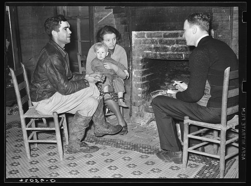 Tenant farmer being interviewed by FSA (Farm Security Administration) Family Section agent, near Pace, Mississippi. Background photo for Sunflower Plantation