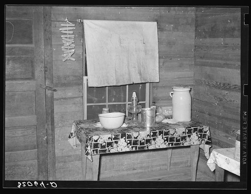 Kitchen table, farm family near Pace, Mississippi. Background photo, Sunflower Plantation