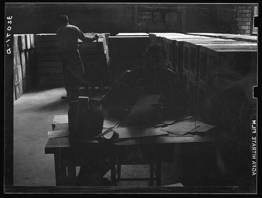 Untitled photo, possibly related to: Checking clerk, citrus packing plant. Weslaco, Texas
