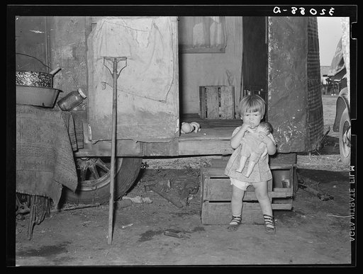 Child in front of trailer home of migrant parents. Weslaco, Texas. See 32108-D caption