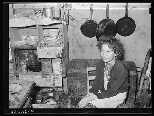 Daughter of former white labor contractor, now migrant worker, in tent home. Weslaco, Texas