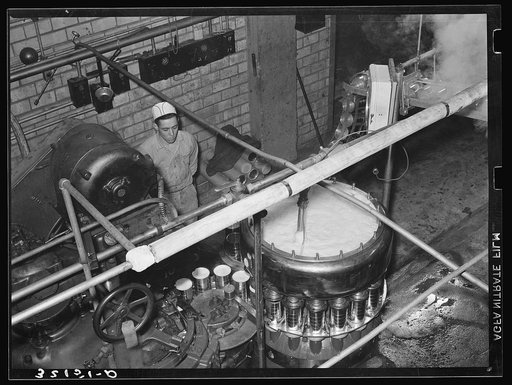 Canning machine. Grapefruit juice cannery, Weslaco, Texas