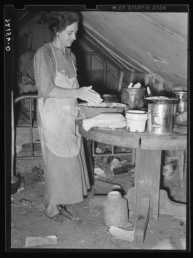 White migrant mother making biscuits in tent home. Mercedes, Texas. See 32108-D