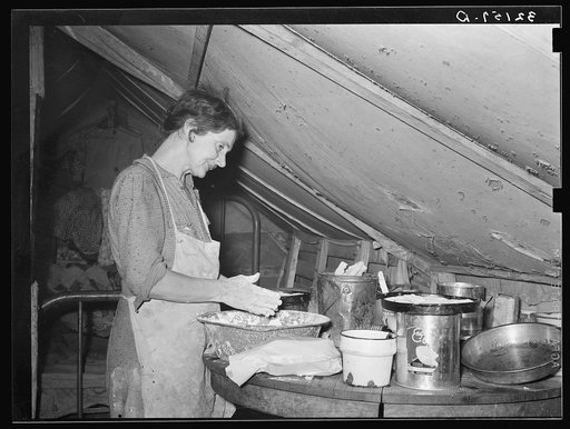Migrant mother making biscuits in tent home near Mercedes, Texas. See 32108-D