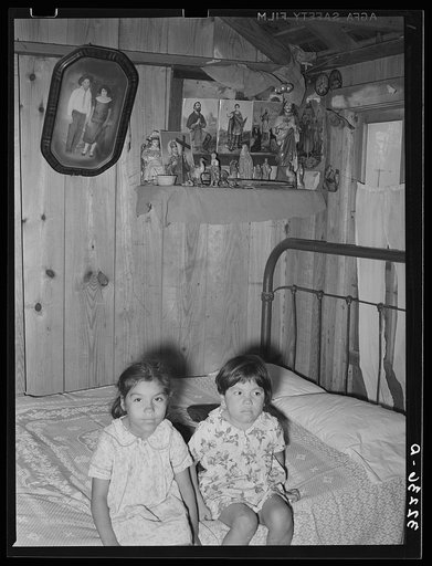 Children of Mexican labor contractor in their home. Robstown, Texas. Note the shrine above the children. These shrines, many quite primitive, are found in practically all Mexican homes