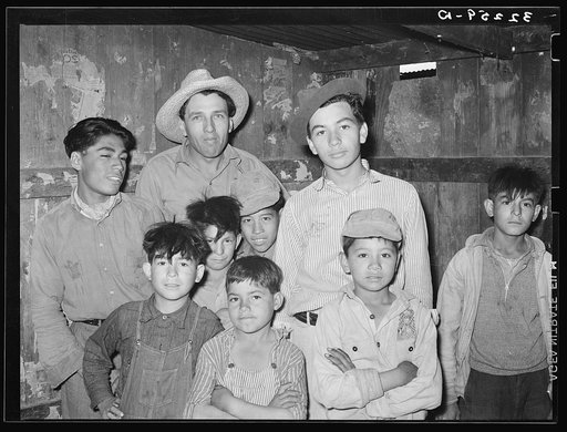 Mexican men and children who live in corral. Robstown, Texas