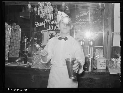 Soda jerker flipping ice cream into malted milk shakes. Corpus Christi, Texas