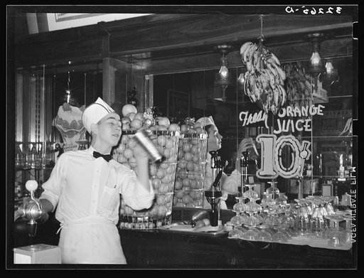 Untitled photo, possibly related to: Soda jerker flipping ice cream into malted milk shakes. Corpus Christi, Texas