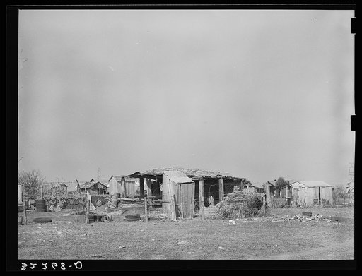 Outbuildings and housing in Mexican district. Robstown, Texas