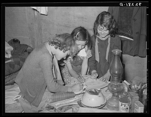 Children of white migrant auto wrecker playing with pencils and paper. Nueces Bay, Corpus Christi, Texas