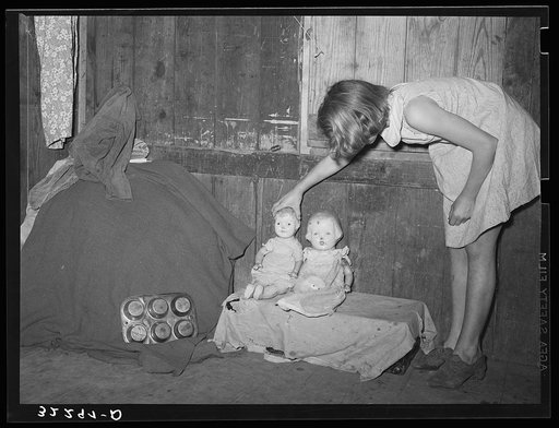 Untitled photo, possibly related to: Mexican girl standing over pan of hot coal in which pail of water is heating. Robstown, Texas