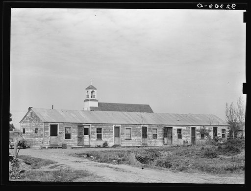 Mexican housing at Edcouch, Texas. Notice church in background