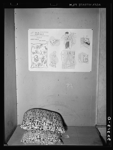 Flour sacked in new printed fabrics. Chart above indicates various uses of the sacking. Throughout the rural areas and in migrant camps garments made of this sacking are seen. Migrant camp near Sebastian, Texas