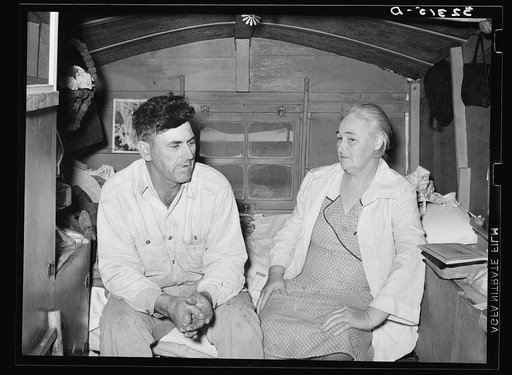 White migrant and his wife in trailer home near Sebastian, Texas. He is from west Texas and she from Virginia. These migrants around Sebastin expressed a fear of regimentation under various governmental projects, saying that they had heard that under FSA (Farm Security Administration) all food bough