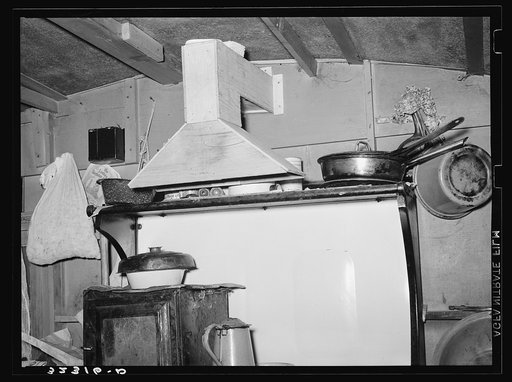 Kitchen range and homemade ventilator in trailer belonging to white migrant camped at Sebastian, Texas