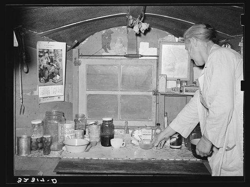 Kitchen table and one end of trailer belonging to white migrant encamped at Sebastian, Texas