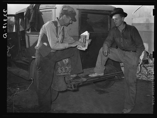 White migrant talking in camp near Edinburg, Texas. These people claimed that they were not migrants, even though it was obvious that they were doing migrant day labor and the condition of their tents showed that they had been on the road for a long time. They expressed themselves as needing nothing