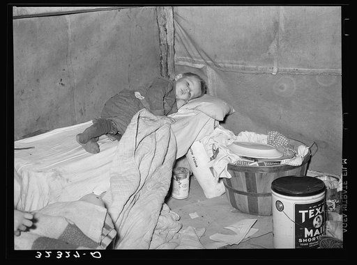 Child with measles in tent home of his migrant parents. Edinburg, Texas
