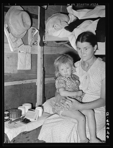 Mother and child, white migrants, in trailer home near Edinburg, Texas