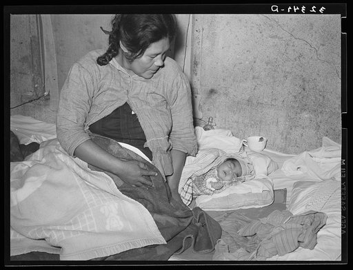 Mexican mother with three days old baby, born in this home. Crystal City, Texas