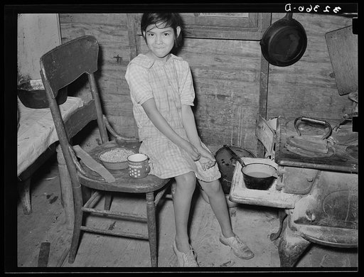 Untitled photo, possibly related to: Mexican child with dried beans which play a large part in the Mexican diet. Crystal City, Texas