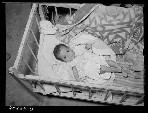 Mexican baby. This child is suffering from malnutrition. Notice the legs and arms. Crystal City, Texas