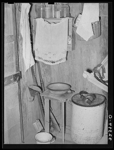 Washstand in corner of Mexican one-room dwelling. Crystal City, Texas