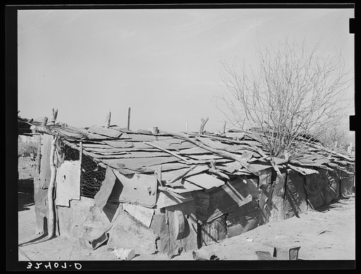 Chicken house made of flattened-out automobile parts. Crystal City, Texas. Mexican section