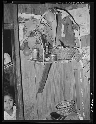 Basket and decorations on shelf in Mexican home. Crystal City, Texas